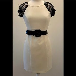 Cream colored dress with black lace sleeves